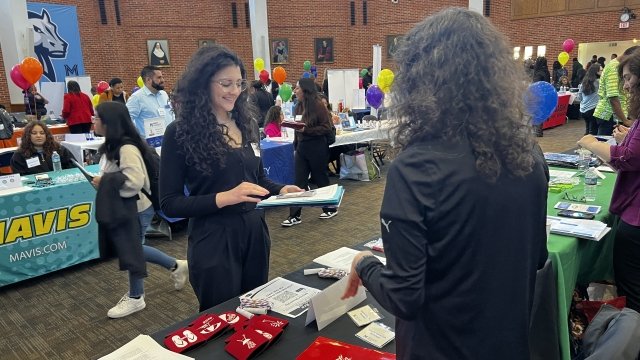 Mercy University student speaks to recruiter at 2024 Career Fair