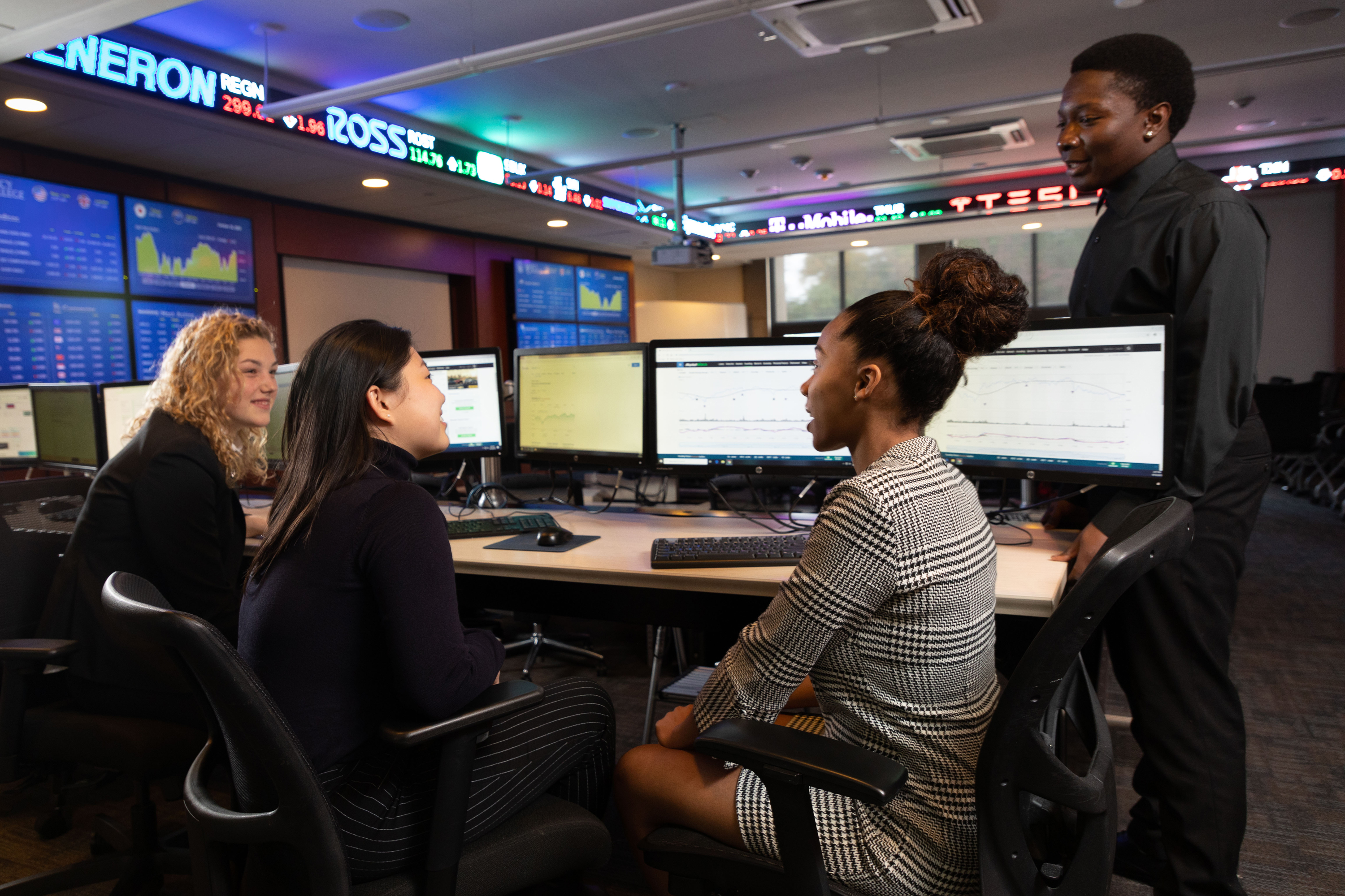 Business students talking in the trading room
