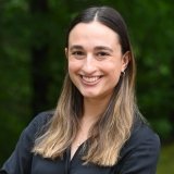 headshot of Rachel who is a white woman with brown hair