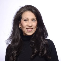 Photo of Wendy K. Mages wearing a black turtleneck
