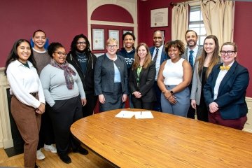 Mercy University President Susan L. Parish and Tessa Kratz, Senior Managing Director of the KIPP Forward Postsecondary Success Collaborative (front and center), surrounded by Mercy and KIPP staff and students.