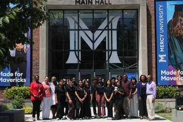 High school students from the White Plains Youth Bureau in front of Mercy University Main Hall