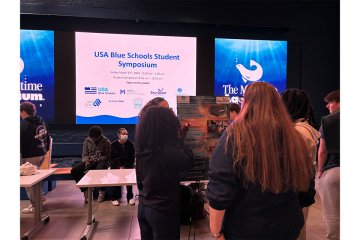 Students present at the USA Blue Schools Student Symposium