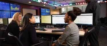 Students learning in Mercy trading room