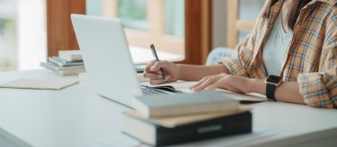 person working on a computer at a desk