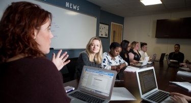 Students with computers in liberal arts class