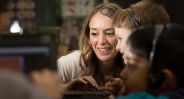 Teacher giving student personal attention.
