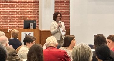 Provost and Senior Vice President of Academic Affairs Kristin Curry Greenwood addresses audience at Spring Faculty Seminar Day