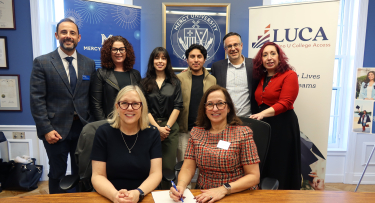 Mercy University and LUCA leadership and students pose at official signing ceremony of new partnership