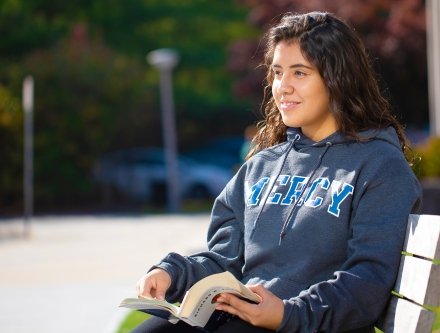 Student sitting on a bench