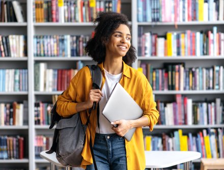student in library