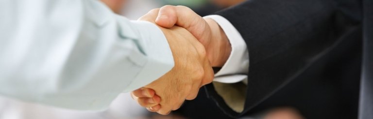 Handshake between Human Resource Manager and job candidate.