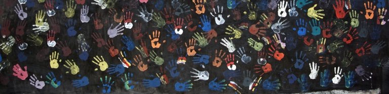 Multi-colored handprints representing the nation's of the world.