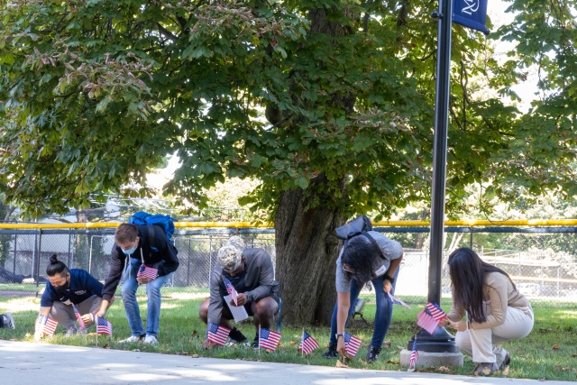 Photo of students planting flags at 9/11 event