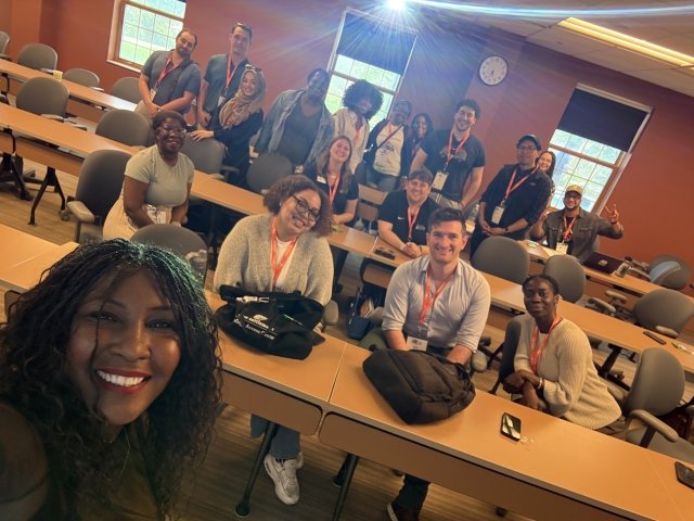 Mercy employee poses with participants at her workshop on wellness during NYSACAC 