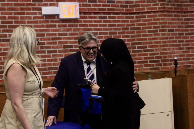Prof. Robert Bohn congratulates 7th Annual Student-Preneur Business Plan Competition winner