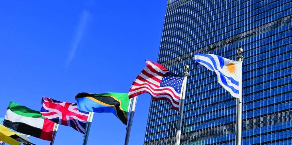 International flags in front of United Nations building.