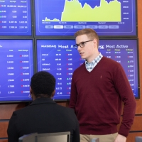 Students learning in Mercy trading room